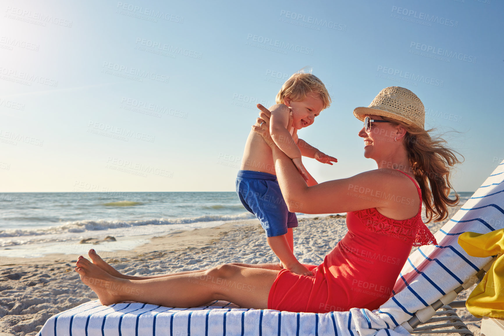 Buy stock photo Woman, holding and child on beach with love on holiday, vacation in Istanbul for happiness or memory. Excited, mom and kid for relax, together and bonding in play for growth, development or playing