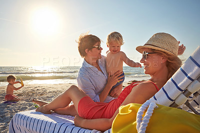 Buy stock photo Chair, sunset or family with woman at beach on holiday vacation or weekend together with dad or kids. Father, calm mother or children siblings at sea for bonding or break in nature in Spain in summer