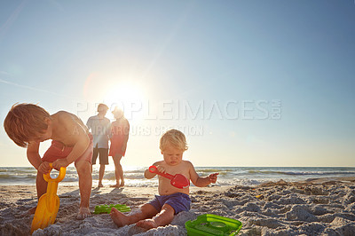 Buy stock photo Sky, family and children with sand castle on beach for holiday, travel or vacation together. Mom, dad and kids playing outdoor on tropical island coast with toys for bonding, building or development