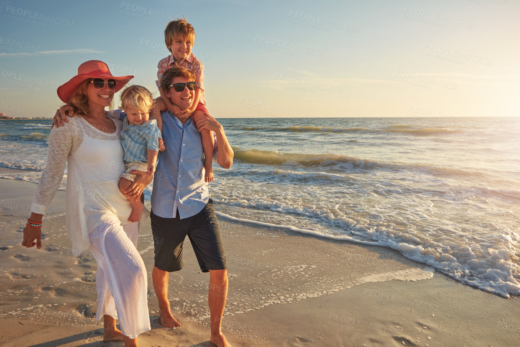 Buy stock photo Walking, holiday and fun for family, beach and bonding in trip, journey and summer in California. Sea, peace and children will parents, waves and water of ocean, couple and man with woman together