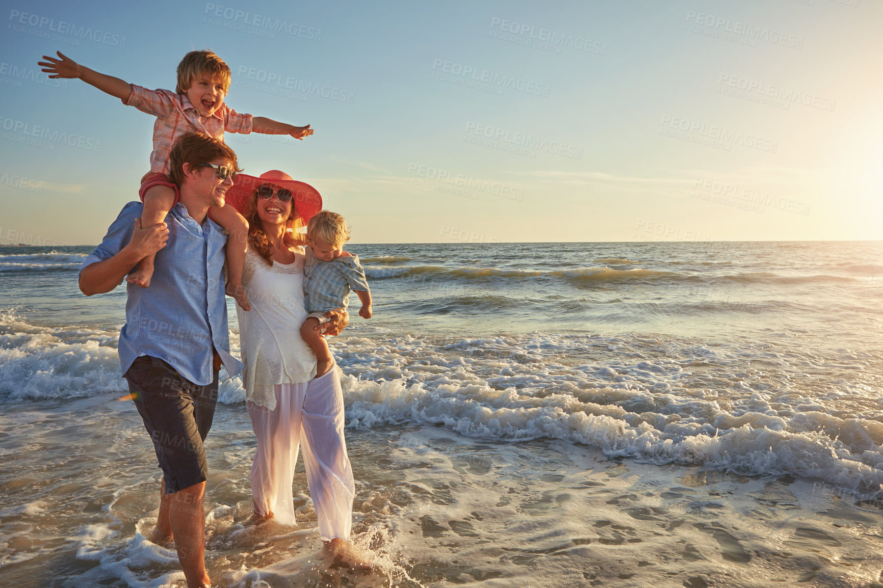 Buy stock photo Outdoor, holiday and fun for family, water and bonding in trip, walking and beach in California. Sea, peace and children with parents, waves and vacation of ocean, couple and man with woman together