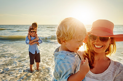 Buy stock photo Happy mother, family and beach with hug for bonding, outdoor holiday or weekend in sunset or nature. Mom, child and little boy with smile for embrace, love or care in sunshine by ocean coast or sea