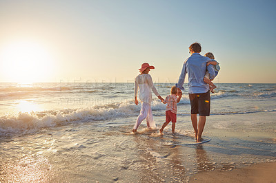 Buy stock photo Family, parents and children on beach trip for holiday fun, vacation and adventure with love. Couple, man and woman and kids on seashore walking with sunset for summer break, support and back view