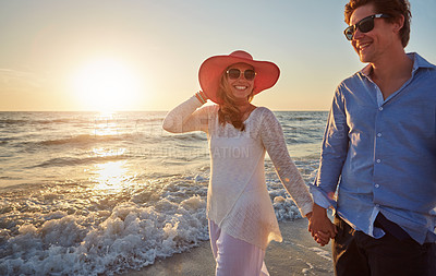 Buy stock photo Couple, man and woman on beach trip for holiday fun, vacation and adventure with love. Relationship, male person and partner on seashore walking with sunset for summer travel, support and wellness 