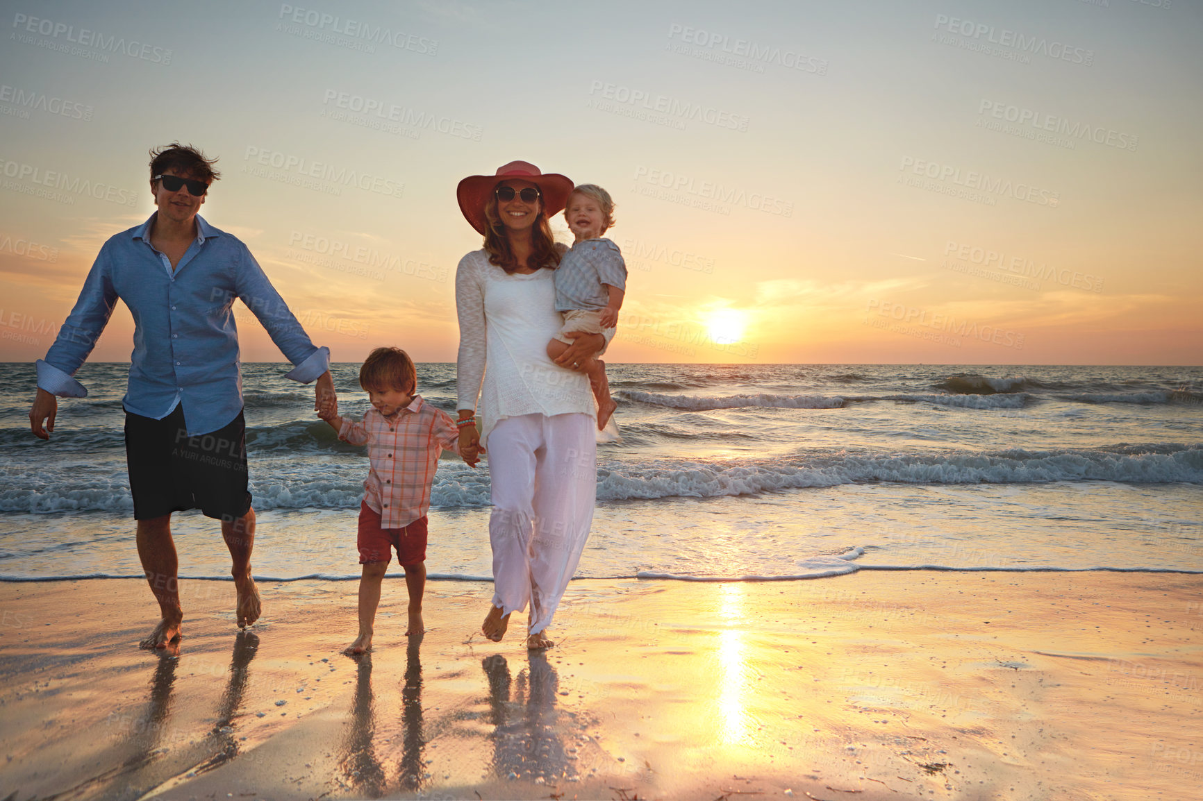 Buy stock photo Family, parents and children holding hands on beach trip for holiday fun, vacation and adventure with love. Couple, man and woman and kids on seashore walking with sunset for summer break and support