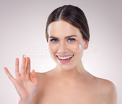 Buy stock photo Woman, finger and studio for moisturizer portrait, beauty and cosmetics lotion for even skin tone. Female person, dermatology and hydration glow on background, sunscreen and cream for transformation