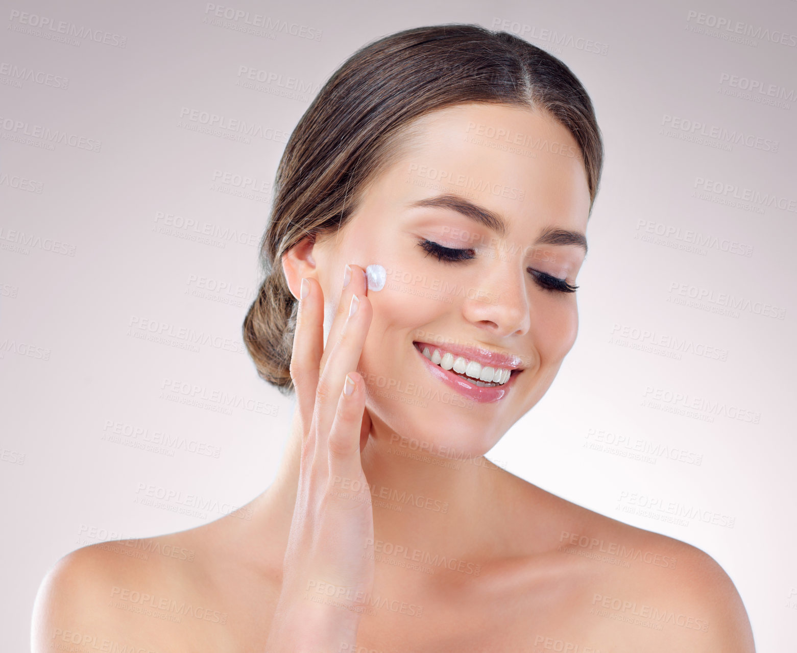 Buy stock photo Woman, apply and moisturizing skincare for facial, beauty and cosmetics lotion for even skin tone. Female person, dermatology and hydration glow on studio background, sunscreen and grooming routine