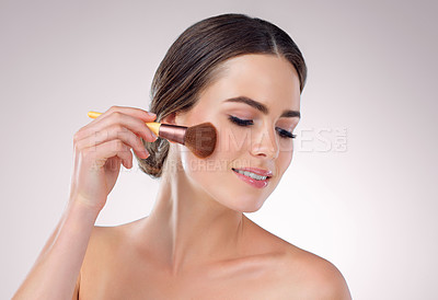 Buy stock photo Woman, powder brush and makeup in studio, skincare and cosmetics tool for highlighter. Female person, facial treatment and white background for dermatology, foundation transformation and apply blush