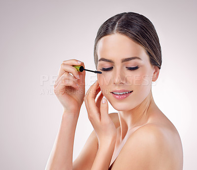 Buy stock photo Makeup, cosmetics and woman in studio with mascara for self care, beauty and face treatment. Glow, eyelash extensions and female person with facial cosmetology by white background with mockup space.