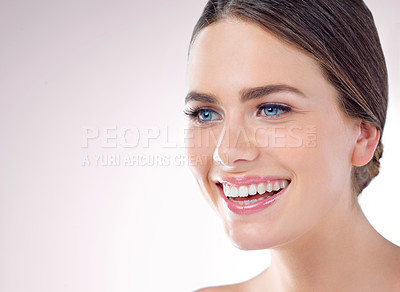 Buy stock photo Studio shot of a beautiful young woman posing against a grey background