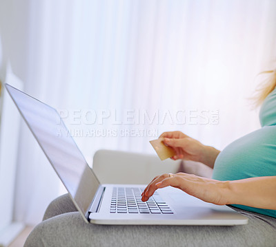 Buy stock photo Closeup shot of a pregnant woman doing some online shopping at home