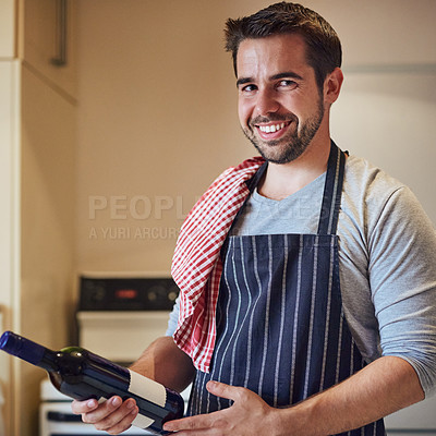 Buy stock photo Portrait, man and wine in kitchen for cooking, meal preparation and happy with product quality. Private chef, smile and bottle at home for romantic dinner, luxury and idea for new flavor in food