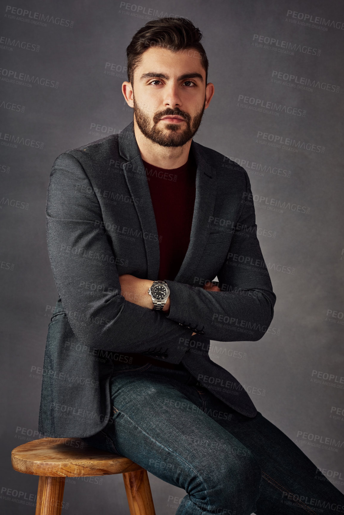 Buy stock photo Man, portrait or fashion in studio for confidence, style or mysterious aesthetic. Gentleman, designer clothing or arms crossed on dark background with luxury watch, expensive taste or sitting on seat