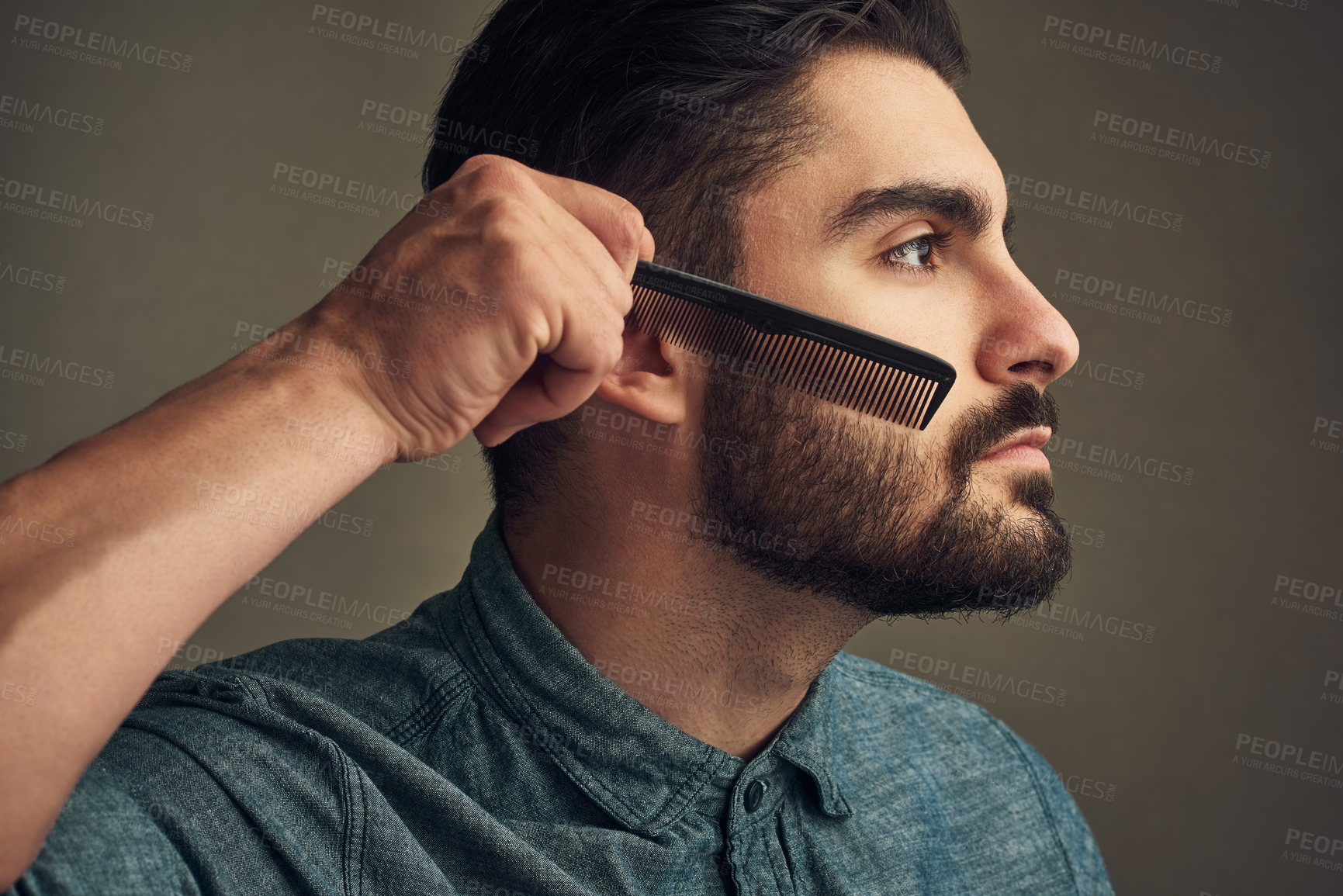 Buy stock photo Man, grooming and comb beard on studio background for facial hair maintenance, self care and texture. Male person, cleaning and personal hygiene on face for skin, beauty and morning routine as barber