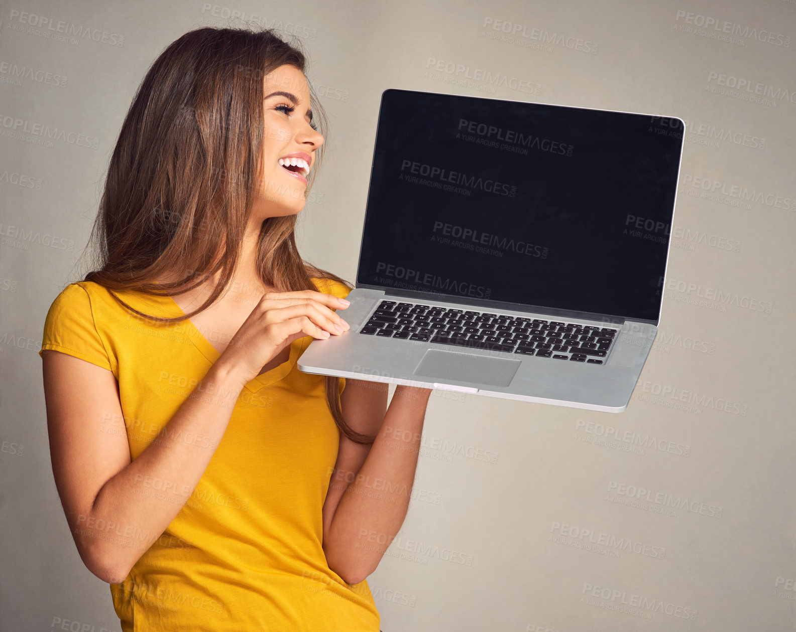 Buy stock photo Thinking, smile and woman with laptop screen in studio for connection, website and online info. Person, happy and tech with mockup space for freelance trading, registration or news on gray background