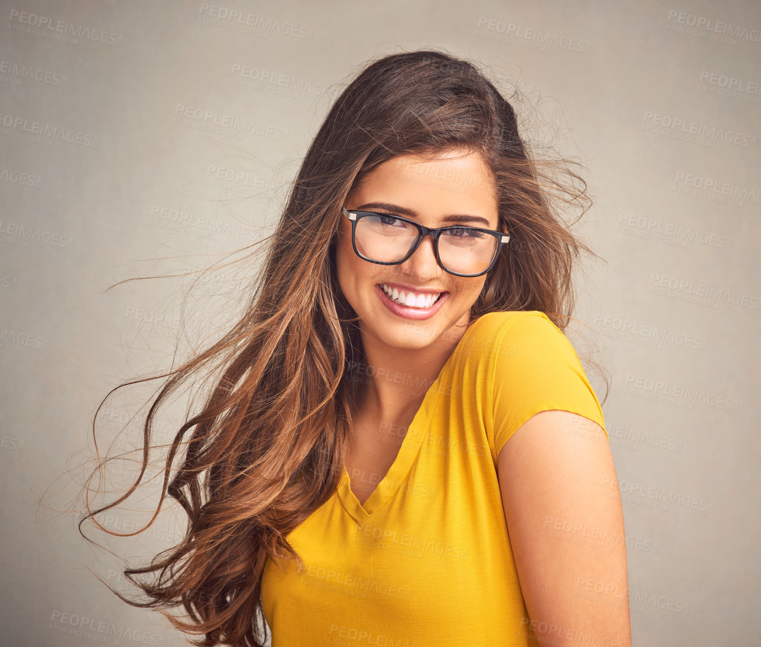 Buy stock photo Studio, confidence and portrait of happy woman with glasses, smile and positive attitude in trendy fashion. Relax, face and girl in gen z style with pride, vision and eye wellness on grey background