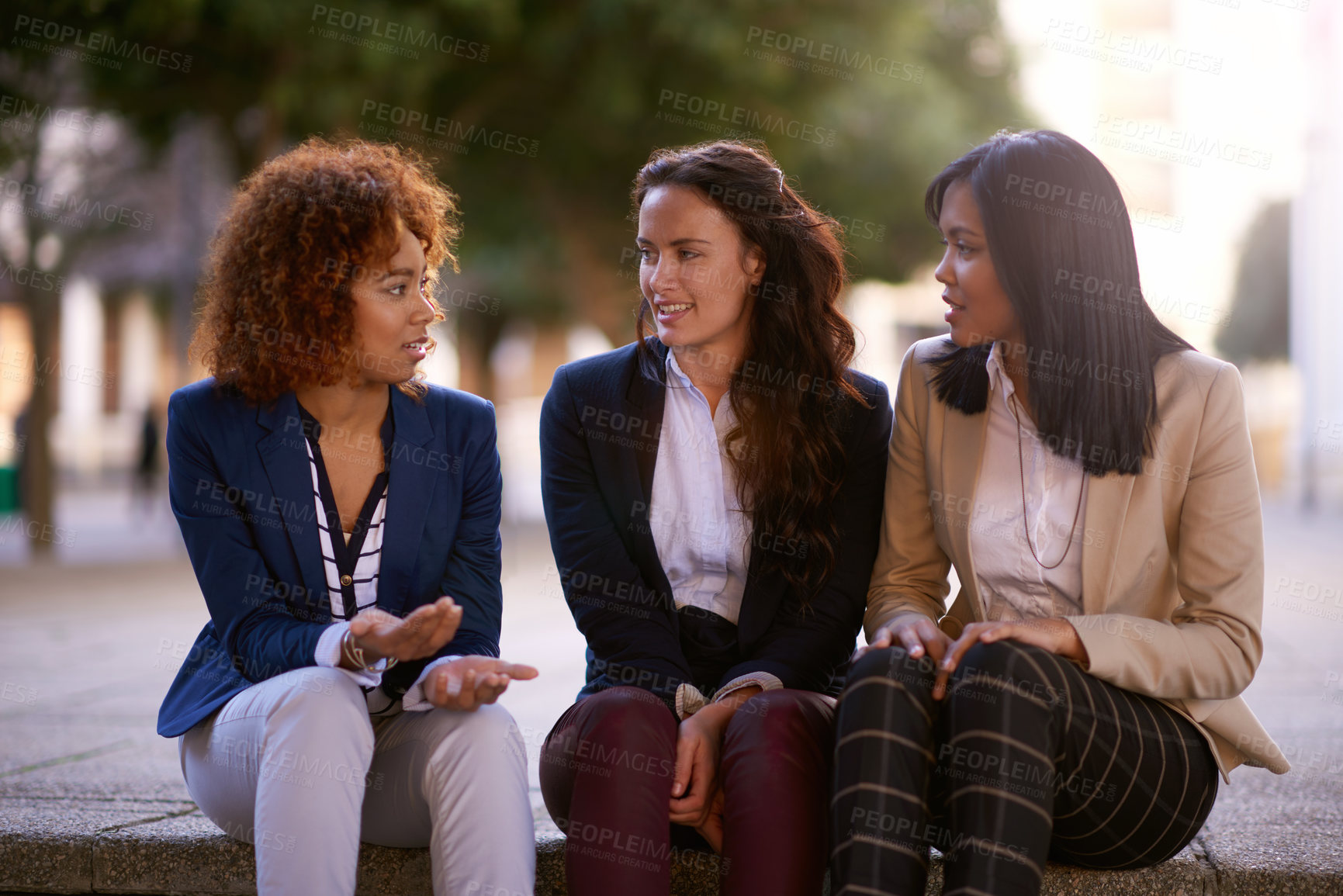 Buy stock photo Business, conversation and women on city steps with planning meeting, support and brainstorming together. Corporate staff, urban park and talking for gossip with work break and drama story outdoor