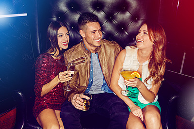 Buy stock photo Women, man and friends in nightclub with drink, glass or cocktails for vip event, gathering or reunion. Group, relax or happy people in dark disco couch for fashion, alcohol or social celebration