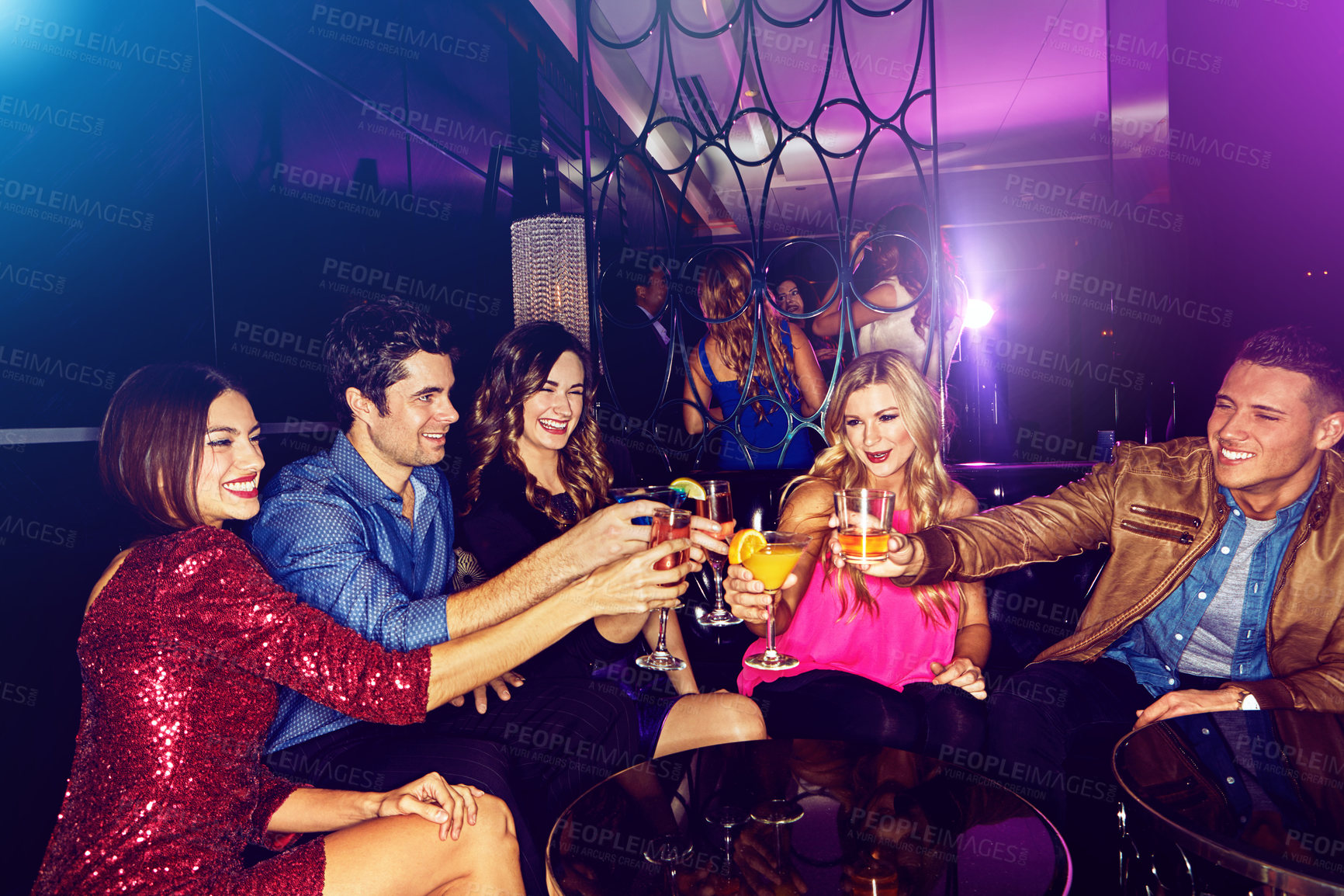 Buy stock photo Party, toast and new year with friends in a club, drinking during a celebration event together. Birthday, crowd and cheers with a man and woman friend group enjoying a drink while bonding in a club