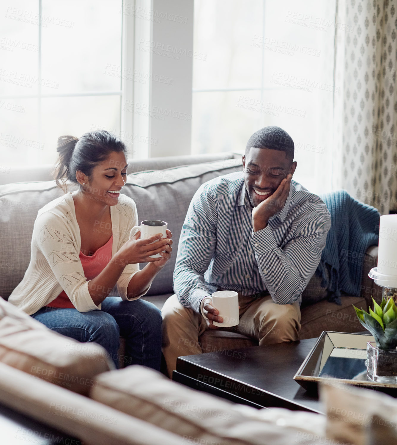 Buy stock photo Couple, coffee and relaxing on sofa in morning for conversation or talk in living room. Discussion, woman and man with smile, happy and married with tea for day plan or romantic date in summer home.