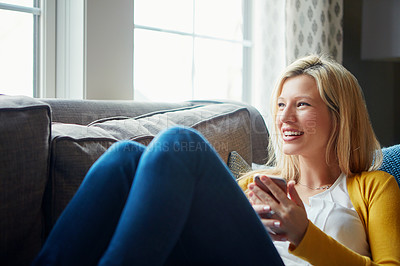 Buy stock photo Smile, thinking and woman in living room, phone and rest on couch, morning and social media in house. Relax, calm and girl with mobile, happy and peace in lounge, cozy and person in apartment