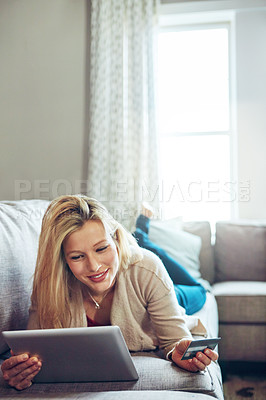 Buy stock photo Woman, credit card and tablet or relax on sofa, fintech and online transaction for shopping in home. Customer, internet payment and sale app or banking, ecommerce and happy for apartment purchase