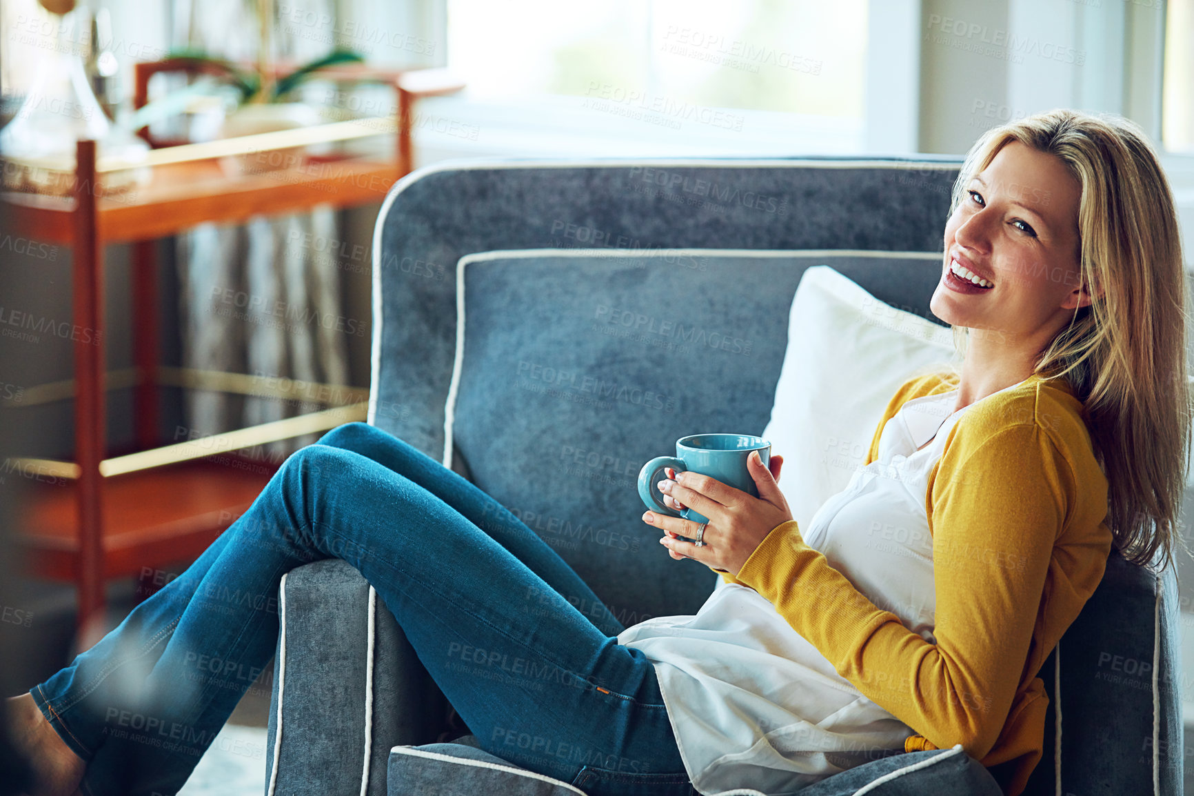 Buy stock photo Woman, relax and drinking coffee in comfort, armchair or break at home with hot beverage. Female person, happy and rest on couch for calm, apartment or peace with happiness in modern house or lounge