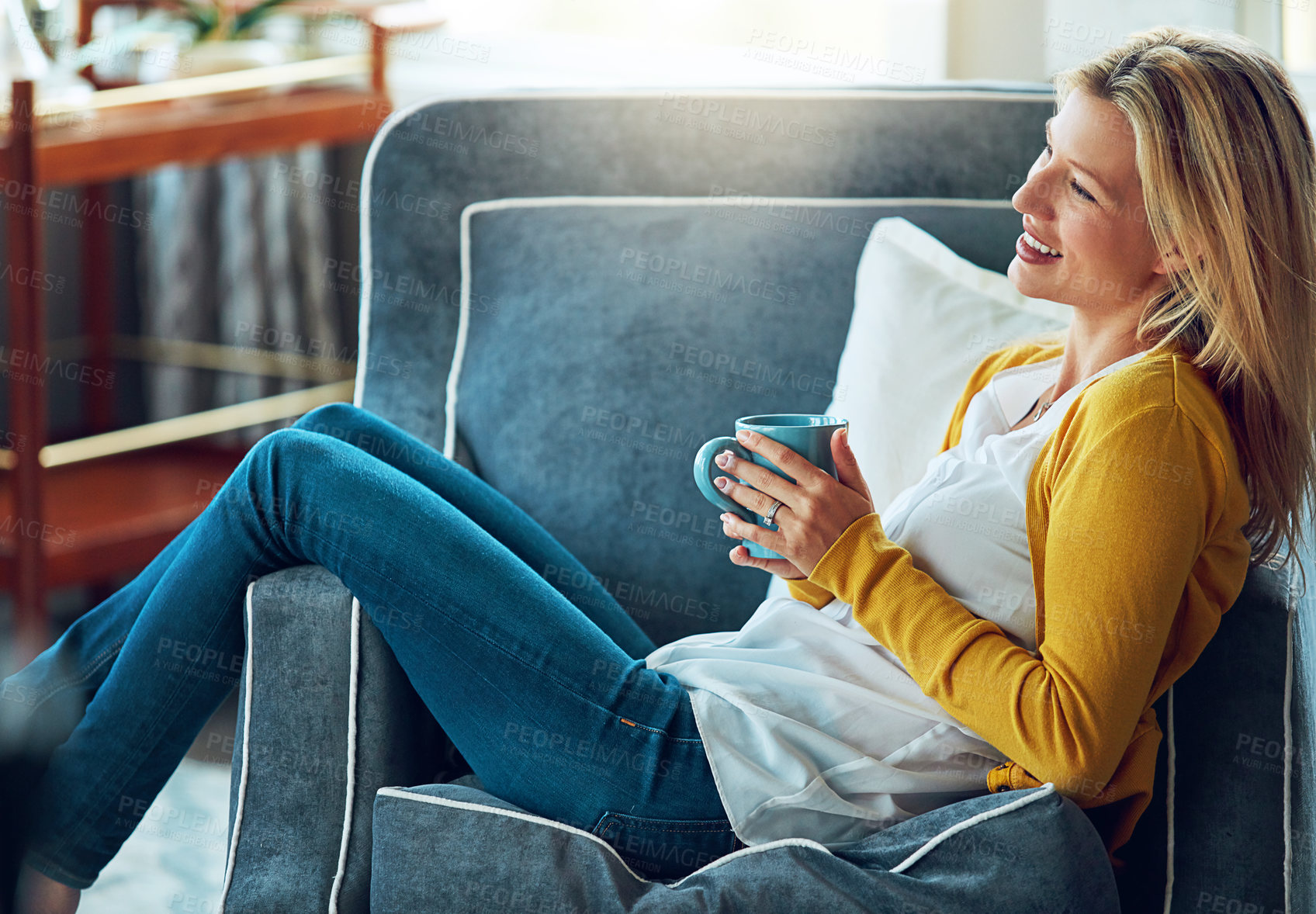 Buy stock photo Happy, coffee and woman relax on sofa in home for chill and calm with drink, beverage and cappuccino. Smile, morning and person with cup, tea and mug in living room for wellness, rest and break