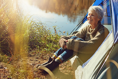 Buy stock photo Camp, mature woman and tent in woods, smile and outdoor to enjoy nature, freedom and sunshine. Retirement, hobby and morning at campsite, happy and healthy with wellness and relaxing natural view