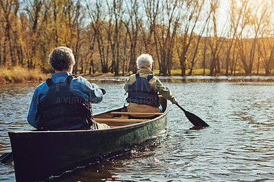 Buy stock photo Senior couple, kayak and rowing in river for holiday, travel or summer vacation in water outdoor together. Man, woman or canoe boat in lake on transport for adventure, exercise or back view in nature