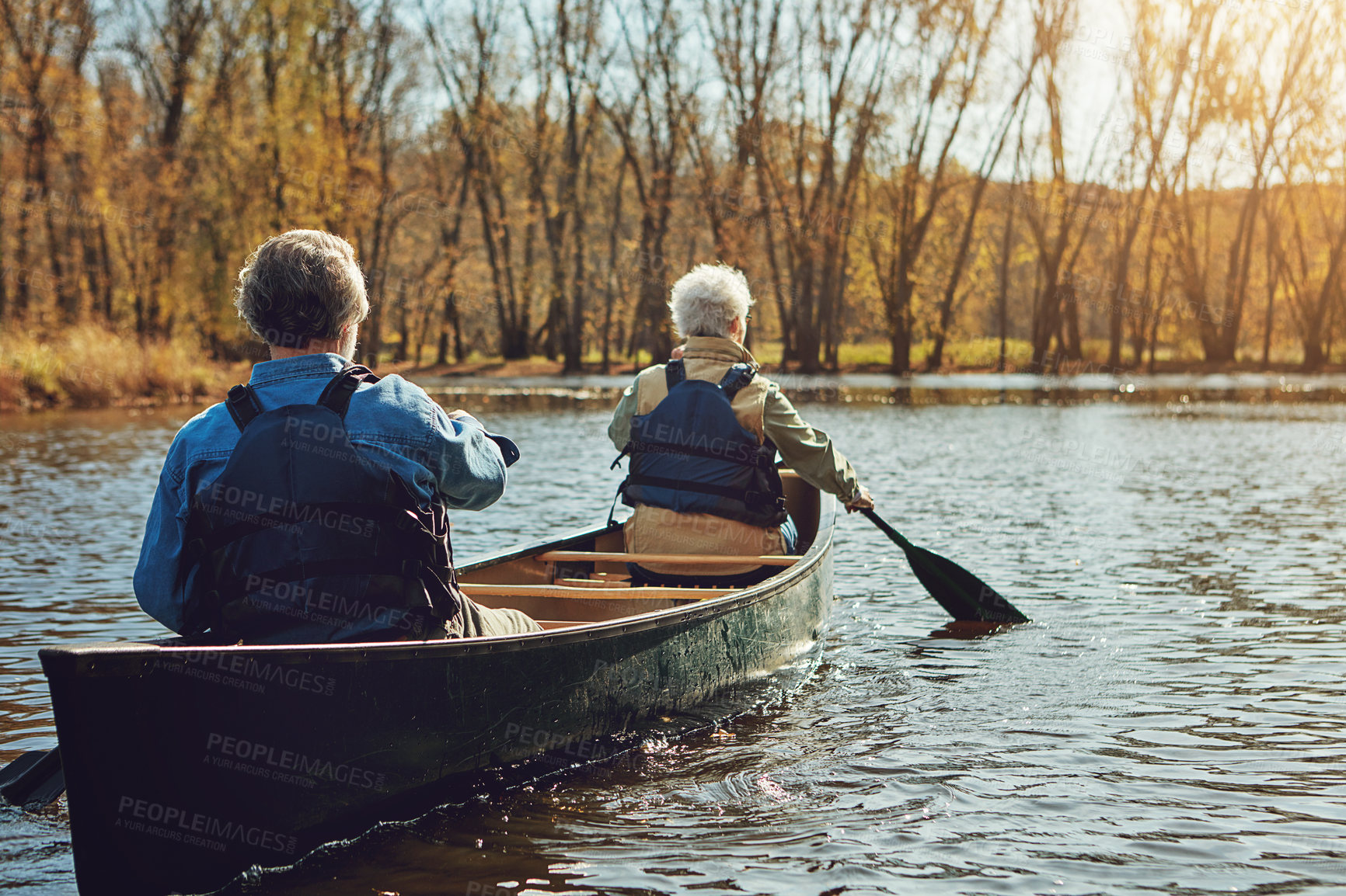 Buy stock photo Senior couple, kayak and rowing in river for holiday, travel or summer vacation in water outdoor together. Man, woman or canoe boat in lake on transport for adventure, exercise or back view in nature