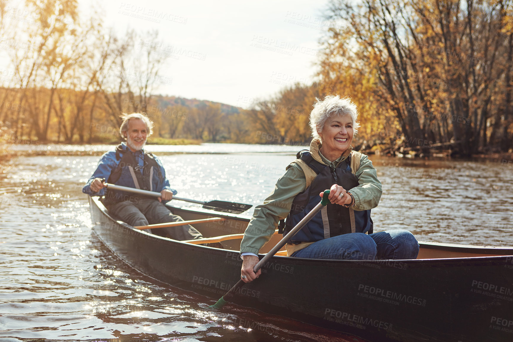 Buy stock photo Lake, rowing and kayak with senior couple, relax and retirement with happiness, weekend break and vacation. Outdoor, river and mature man with old woman, support and trust with holiday and nature