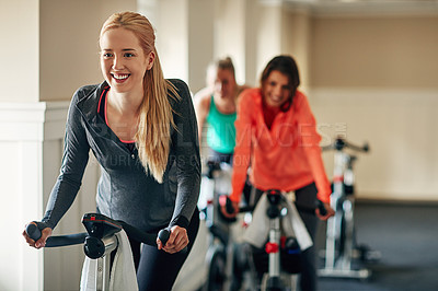 Buy stock photo Fitness, cycling and happy girl at gym with exercise bike for training, wellness and morning cardio together. Spinning class, machine and people at sports studio for workout, challenge or performance