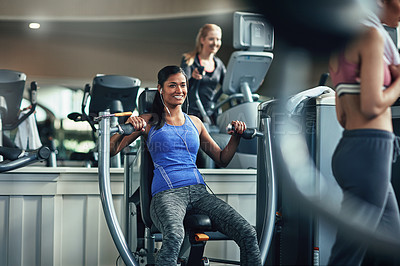 Buy stock photo Gym, Indian woman and happy on chest press machine for workout to exercise for health, fitness and muscles. Female person, smile and satisfied with training for wellbeing, wellness and self care