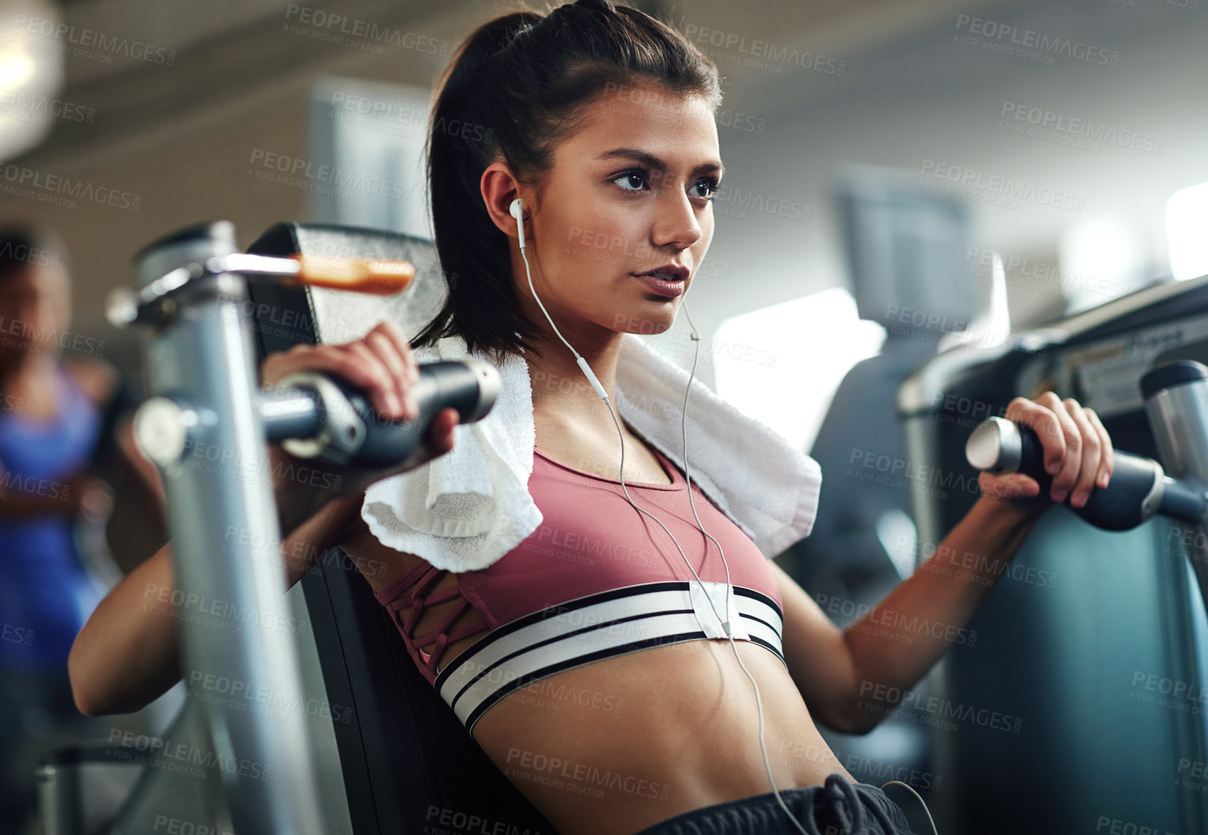 Buy stock photo Girl, workout and chest press in gym for fitness, power and muscle development with earphones or towel. Music, training and exercise in sports club for health, wellness and results with commitment