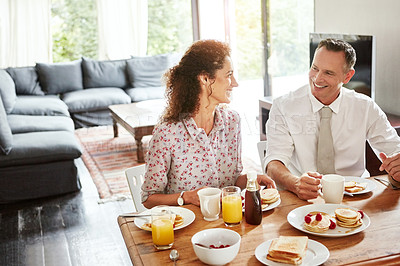 Buy stock photo Shot of a mature couple having breakfast together at home