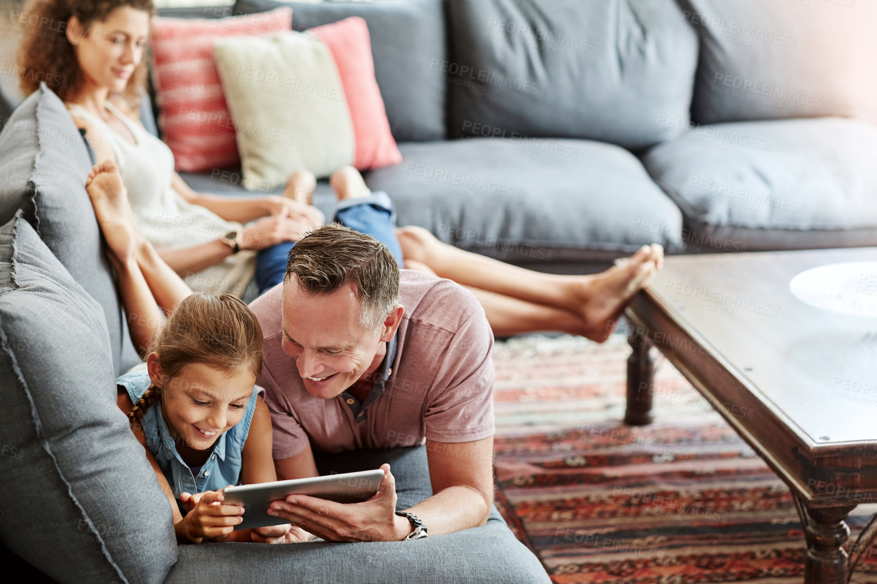 Buy stock photo Family, man and child with tablet in browsing on weekend, break at home for e learning or gaming. Happy people, lounge and relax in together for bonding as parents for growth, development and love