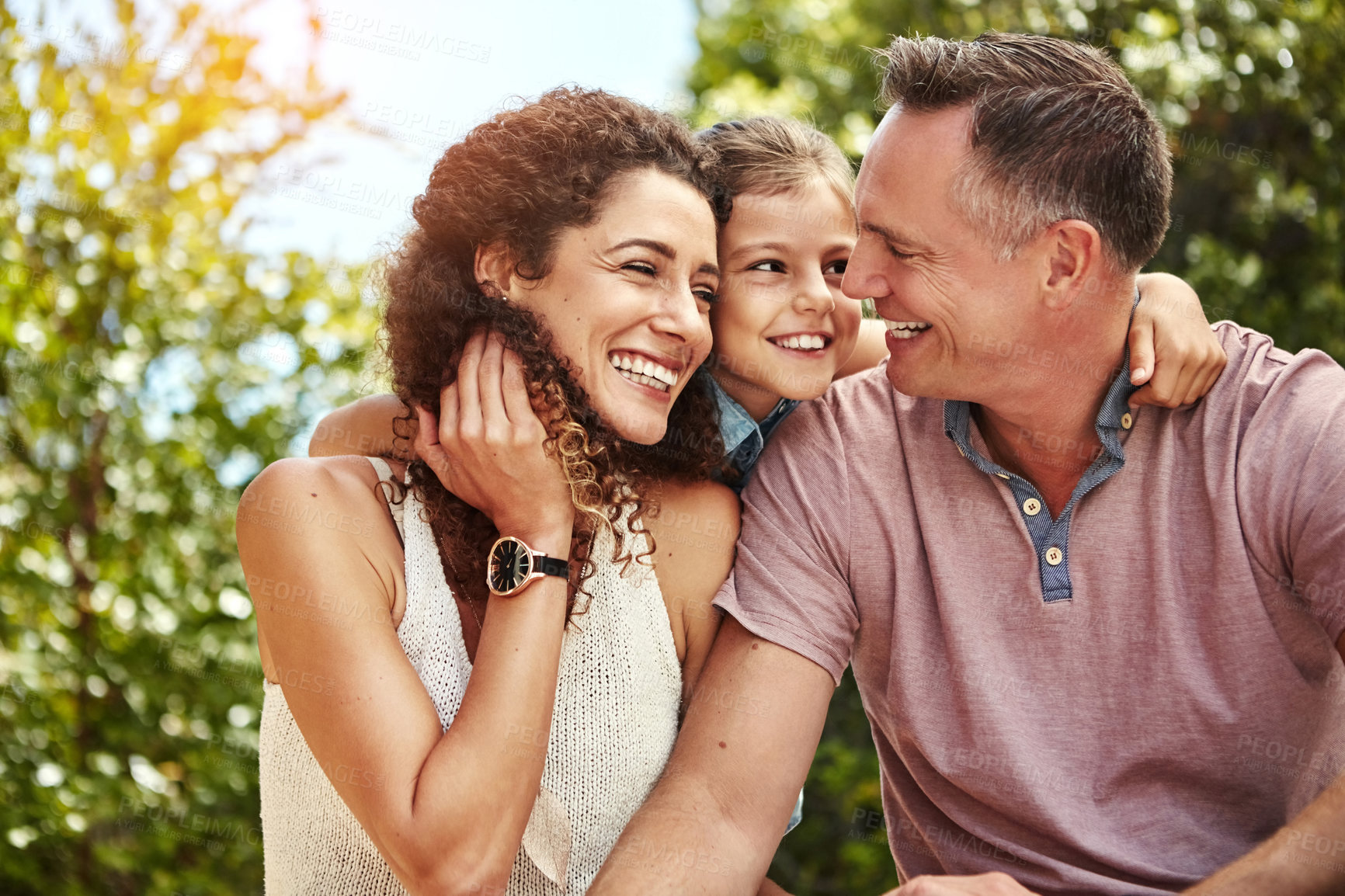 Buy stock photo Shot of a family of three enjoying a day outdoors