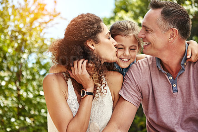 Buy stock photo Shot of a family of three enjoying a day outdoors