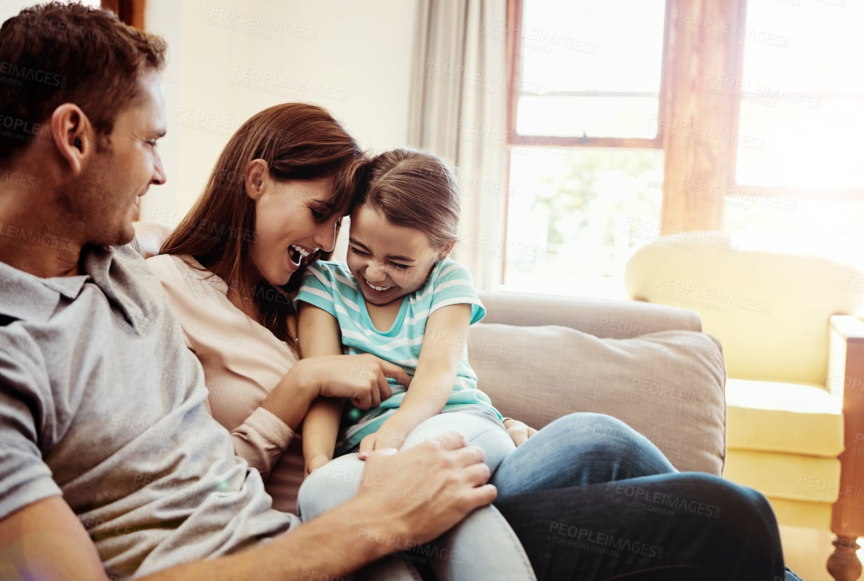 Buy stock photo Shot of a family bonding together at home