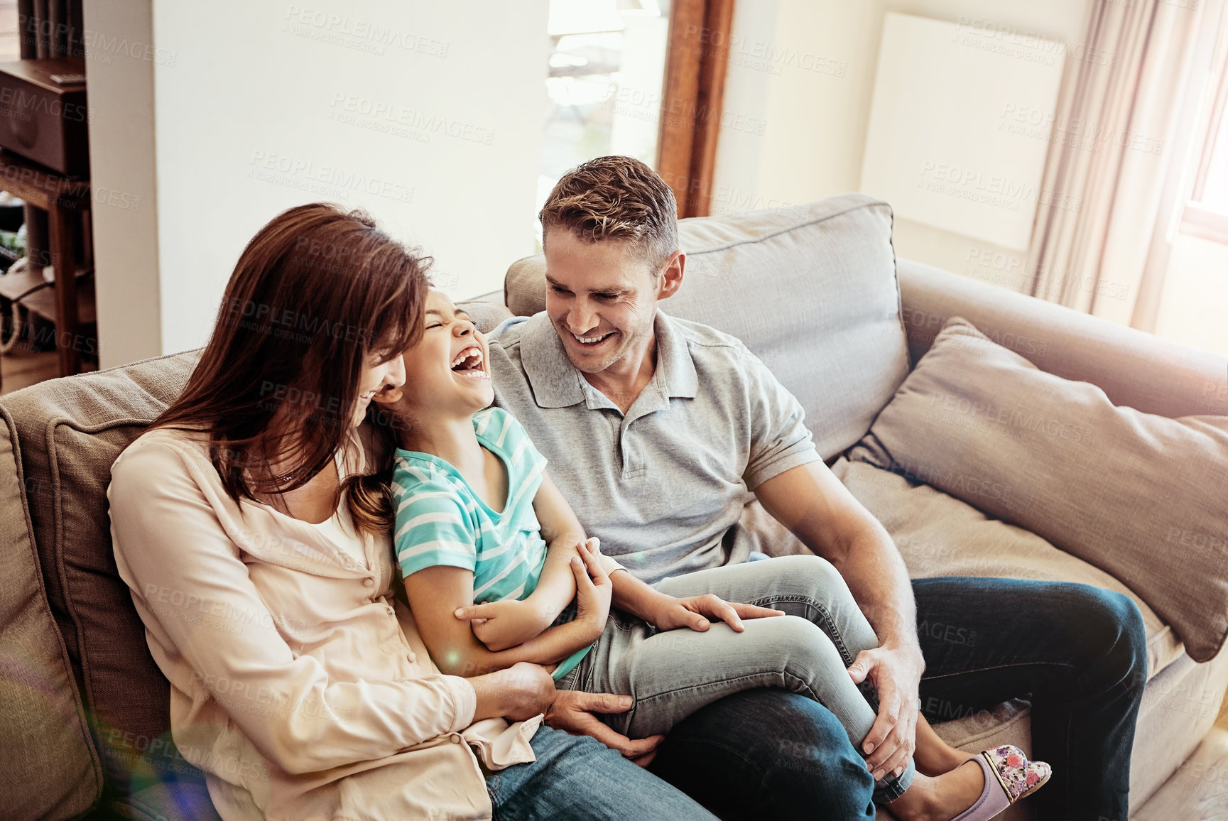 Buy stock photo Shot of a family bonding together at home