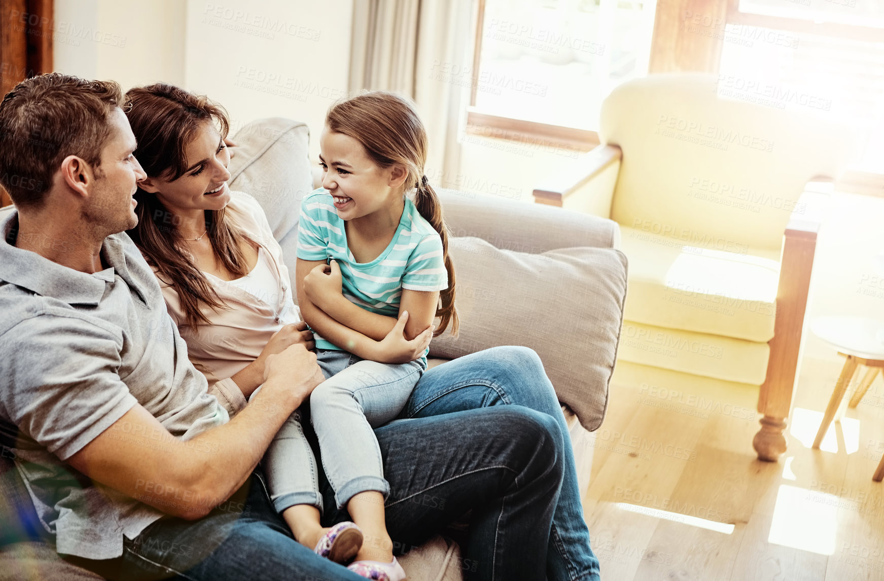 Buy stock photo Shot of a family bonding together at home