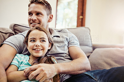 Buy stock photo Shot of a father and his little daughter bonding together at home