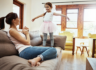 Buy stock photo Shot of a little girl having fun while bonding with her mother at home