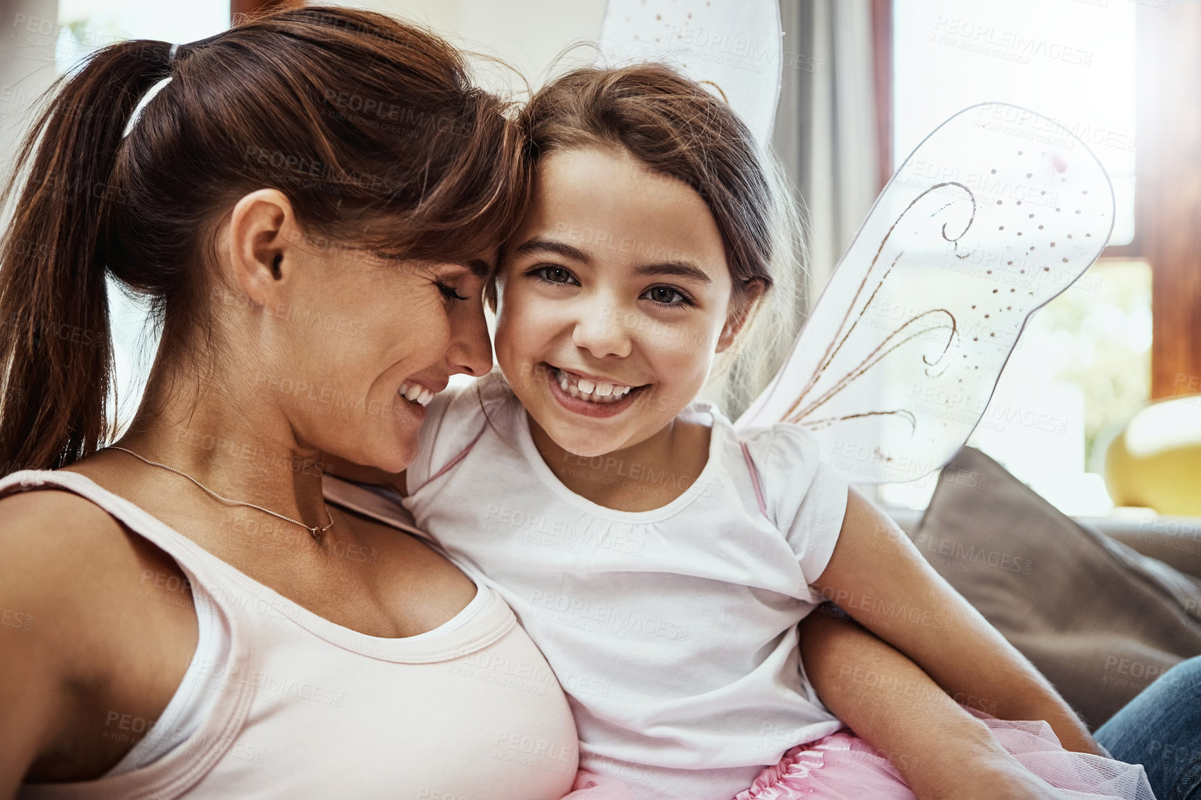 Buy stock photo Mother, girl and happy on selfie on couch for memories, fun and care with support for child development. Parent, kid and smile in living room on sofa for social media, bonding and home with butterfly