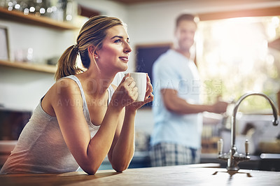 Buy stock photo Girl, coffee and thinking in morning in kitchen for daily breakfast routine, peace and calm for comfort. Woman, beverage and thoughts in home with man or quiet moment, contemplation and mindfulness.