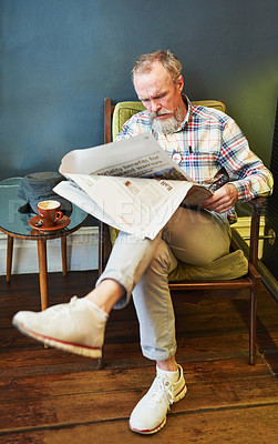 Buy stock photo Newspaper, coffee and senior man reading business information for financial stock market. Serious, cappuccino and elderly male person enjoying economy headlines in journalism article in cafe.