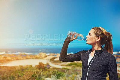 Buy stock photo Woman drink water, beach and fitness with blue sky, athlete outdoor with hydration and mockup space. Exercise by the sea, female person drinking h2o from bottle with workout and break from training