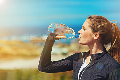 Buy stock photo Woman drinking water, health and fitness in nature, blue sky and athlete outdoor with hydration and mockup space. Exercise at beach, female person drink h2o in bottle, workout and break from training