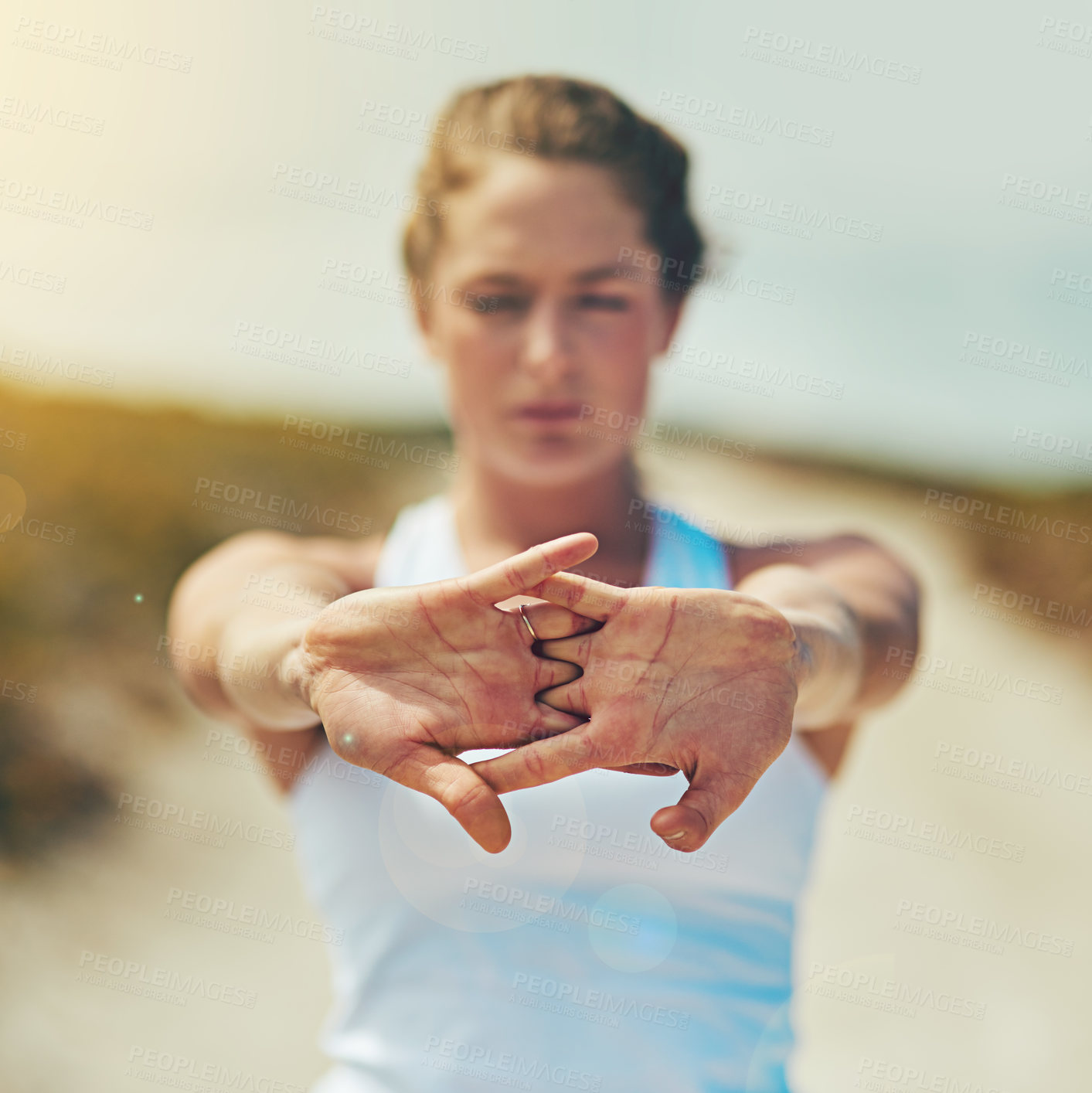 Buy stock photo Shot of a sporty young woman exercising outdoors